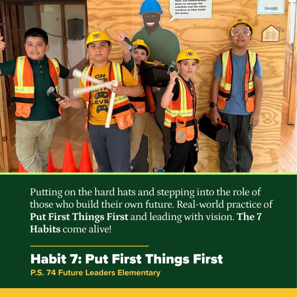 Students wear construction unifrom on a field trip